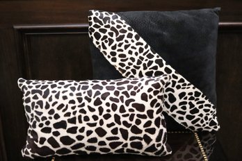 Two Accent Pillows With Leopard Pattern Accents.