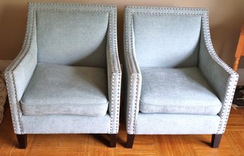 Pair Of Contemporary Armchairs In Aqua/light Teal Velvet Upholstery With Nail Heads And Dark Wood Legs.