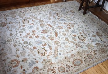Beige/ Olive Neutral Tone Area Rug Carpet From Room And Board, With An Overall Floral Pattern.