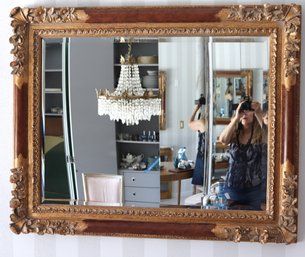 Lovely Antique Style Beveled Mirror With Wide Frame Enhanced By Floral Borders.
