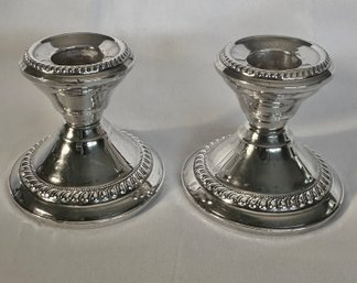 PAIR OF STERLING SILVER WEIGHTED CANDLESTICKS