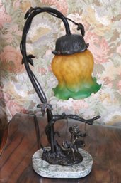 Vintage Art Nouveau Style Bronze Lamp, With Amber, Green Glass Shade And Cherub On Swing.