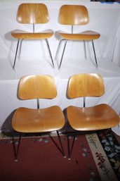 Charles Eames By Herman Miller 4 Dining Chairs With Molded Walnut Plywood, Steel Rods And Rubber Shock Mounts