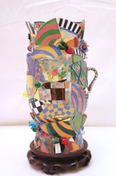 Mackenzie Childs Glass Hurricane Lantern On Carved Wooden Base.