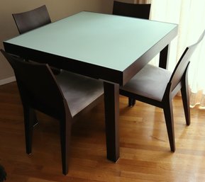 Expansion Table In Dark Wood With Frosted Green Glass Top, Chunky Legs And 4 Chairs.