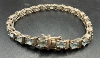 Sterling Silver .925 Blue Topaz 7.25 Inch Tennis Bracelet - .59 TOZ