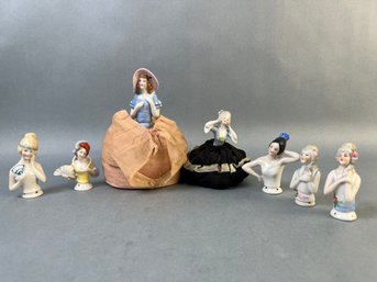 7 Vintage Ceramic Half Doll And 2 Pin Cushion Dresses.