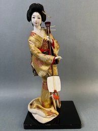 Vintage Geisha Doll On Wood Stand.