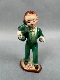 Women In Top Hat And Tails Porcelain Figure.