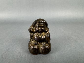 Small Buddha Like Figurine