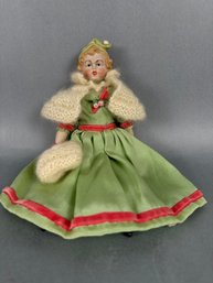 Small Bisque Doll With Green Dress