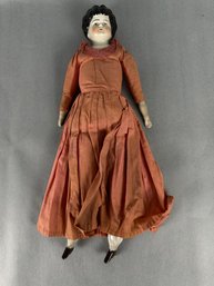 Porcelain Doll With Rust Color Dress