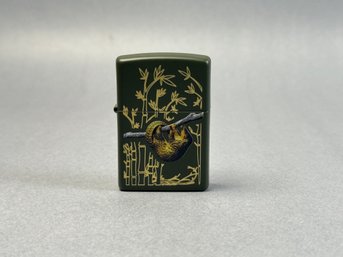 Zippo Windproof Lighter Featuring A Pangolin Design On A Green Matte Background