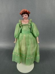 Bisque Girl Doll With Green Dress