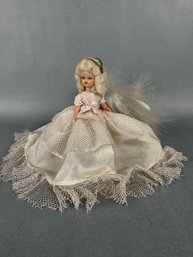 Small Plastic Doll Dressed In White
