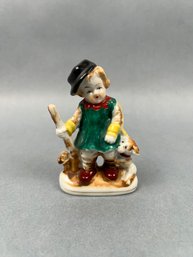 Occupied Japan Porcelain Statue Of A Child And Dog.