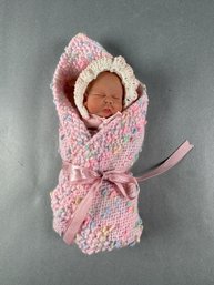 Newborn Girl Wrapped In Pink Blanket