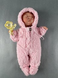 Newborn In Pink Sleeper With Rattle