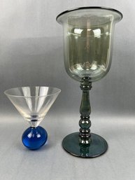 1 Cocktail Glass And A Giant Wine Glass.