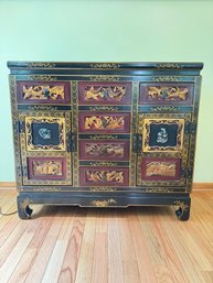Chinese Black Lacquer Cabinet  With Intricate Carvings And Gold Accents