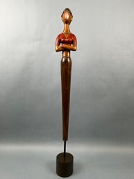 Tall Wood Carving Of Asian Lady With Her Arms Crossed.