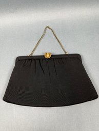 After 5 Black Bag With Gold Chain And Jeweled Pineapple Closure.