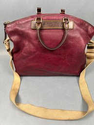 Dooney And Burke Burgundy Leather Purse.