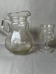 Early American Pressed Glass Floral Design Pitcher And Goblet.