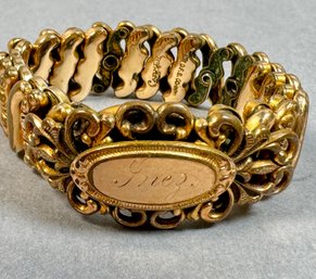 Gold Tone Flexible Band With Name On Plate