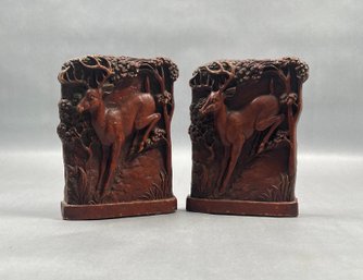 Vintage Bookends Feature A Detailed Relief Carving Of A Deer In A Wooded Scene