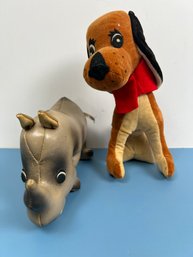 Vinyl Stuffed Rhino And A Stuffed Dog.