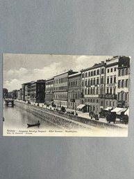 Vintage Postcard Depicting A Riverfront Street Scene