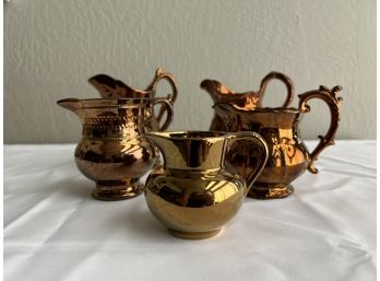 Five Lusterware Pitchers