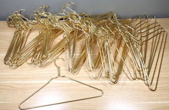 Lot - (61) Gold-tone Clothing Hangers Aluminum