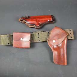 Two Pistol Holsters And An Ammo Case  - One On Web Belt With Ammo Case - One Is A Hunter Holster