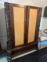 Armoire With Rattan Doors And Carved Pillars