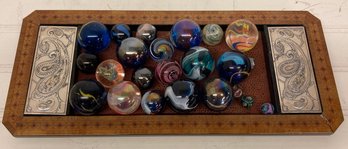 Collection Of Marbles On Decorative Wood Tray