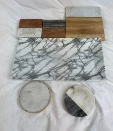 Assortment Of Serving Trays And Solid Coasters