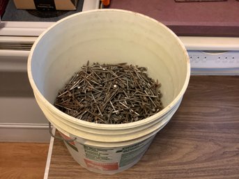 1/2 Of A Joint Compound Bucket Of Nails