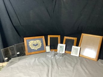 Group Of Picture Frames And Small Stands