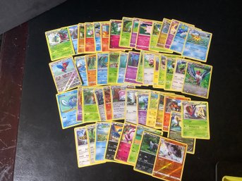 50 Assorted Pokemon Cards- Lot 5 Includes Halo Cards
