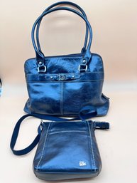 A Giani Bernini Leather Purse And A The Sak Clutch Purse