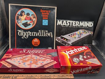 4 Classic Board Games Including Aggravation, Mastermind, Scrabble, And Yahtzee