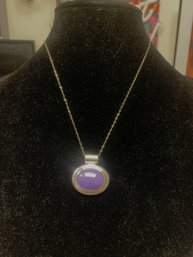Sterling Silver Chain With A Sterling Silver Pendant With A Purple Accent