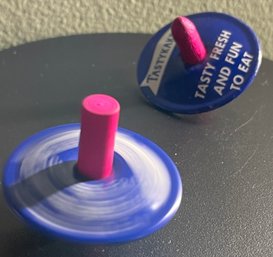 Two 1930s TASTYKAKE Spinner Top Toys Advertising Premiums Metal Wood Stem