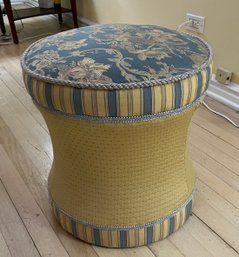 A Contemporary Upholstered Ottoman With Floral And Striped Fabric