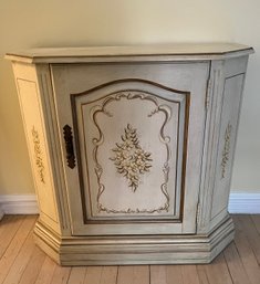 Painted And Distressed Decorative Corner Cabinet With Floral Motifs.