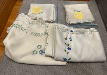 A Vintage White Embroidered Linen Blueberry Tablecloth And Matching Napkin Set.