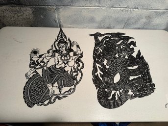 Intricately Cut Thai Shadow Puppets Depicting A Deity And A Demon