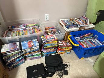 Very Large Lot Of DVDs And Travel DVD Player